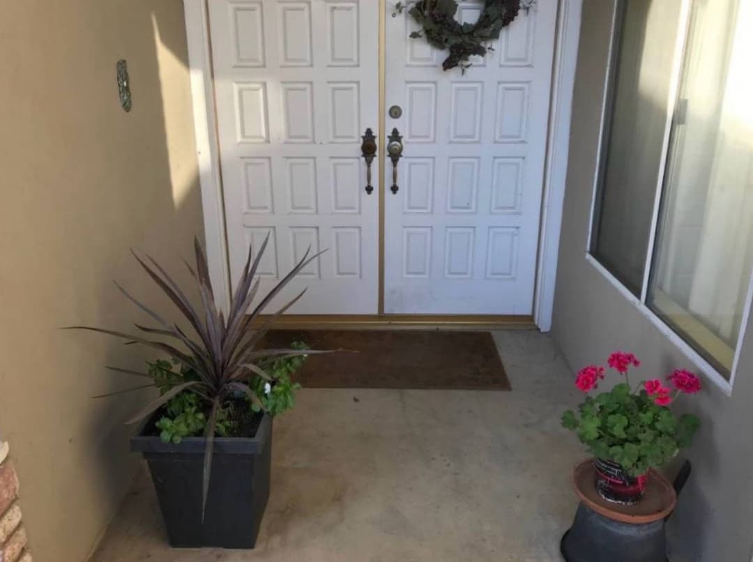 White double front entry doors installed at residential home
