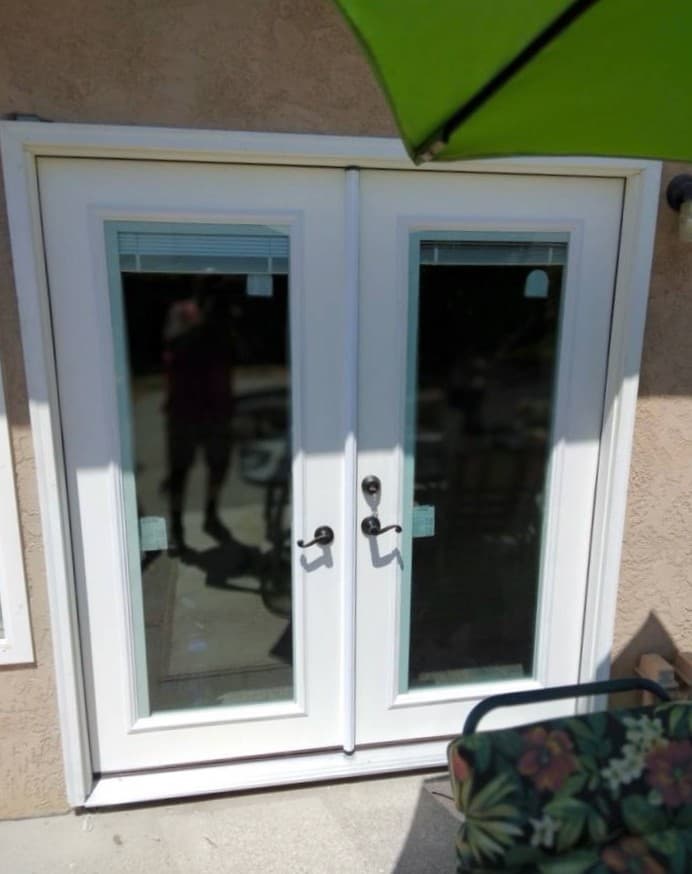 Exterior glass door replacement with updated trim and hardware